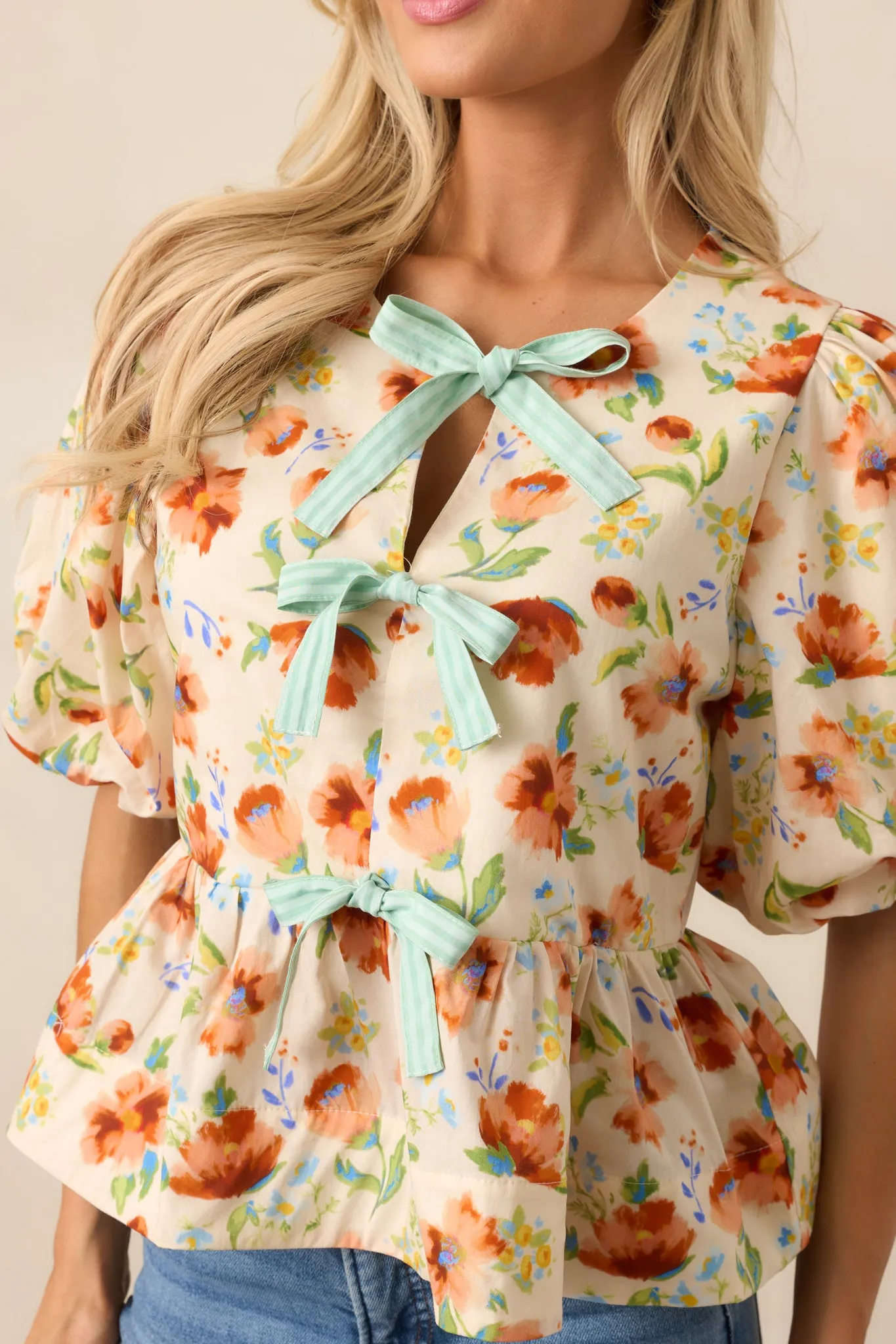 Beyond Compare Ecru Floral Cotton Bow Front Peplum Top