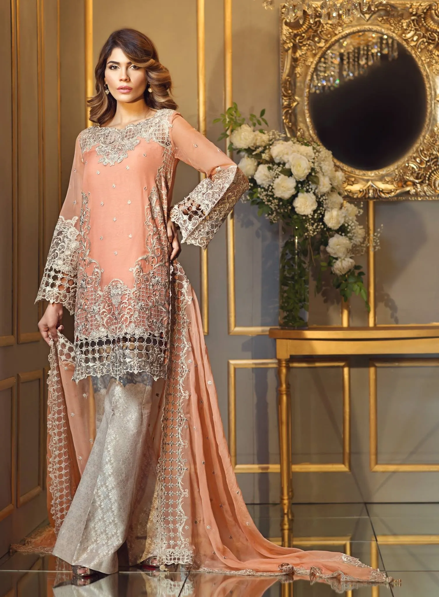Chiffon dress by Anya in peach pink color with threds cutwork and patch embroidery Model #C 567